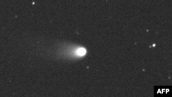 FILE - A photo released on January 4, 2013 of Comet 2011 L4 (Pan-STARRS) observed on Aug. 9, 2012 by David Asher (Armagh Observatory) and student James Hadnett (Royal School Armagh) using the 2-m diameter Faulkes Telescope South at Siding Spring, Australia. (Credit: Armagh Observatory)