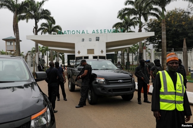 Members of security forces stand at the entrance of the National Assembly in Abuja, Nigeria, Aug. 7, 2018.