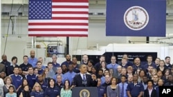 President Barack Obama gestures during a speech on the economy at the Rolls-Royce engine manufacturing plant in Prince George, Virginia, March 9, 2012.