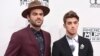 Alex Pall, left, and Andrew Taggart, of The Chainsmokers, arrive at the American Music Awards at the Microsoft Theater in Los Angeles.