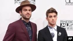 Alex Pall, left, and Andrew Taggart, of The Chainsmokers, arrive at the American Music Awards at the Microsoft Theater in Los Angeles.