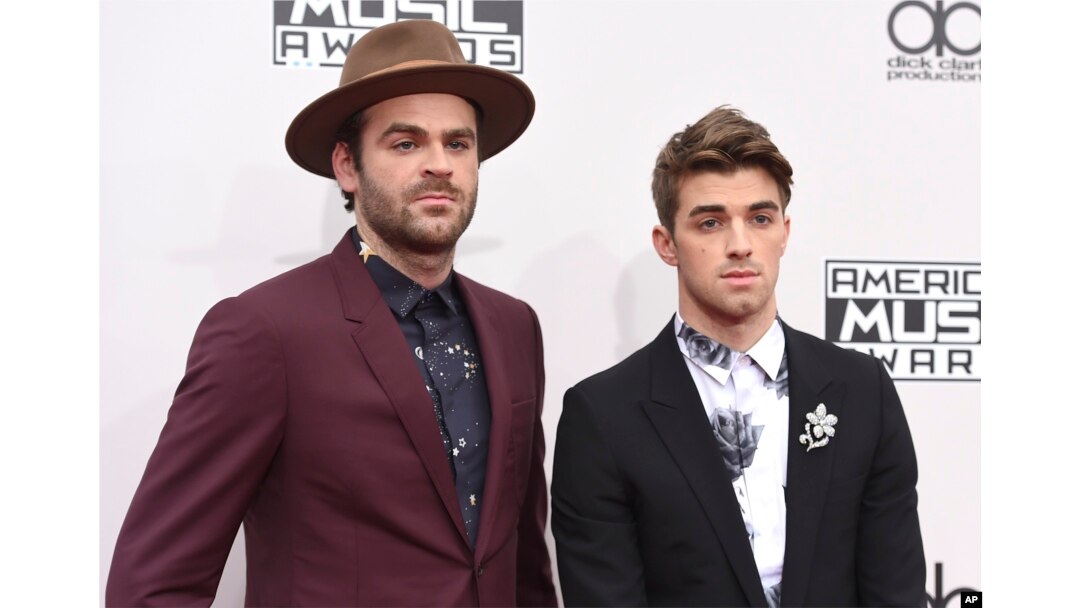 Alex Pall, left, and Andrew Taggart, of The Chainsmokers, arrive at the American Music Awards at the Microsoft Theater in Los Angeles.