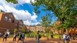 Students walk across the Oxford, Ohio campus of Miami University.