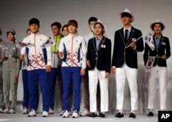 FILE - South Korean Olympic athletes and models present the South Korean Olympic team uniforms for the 2016 Rio de Janeiro Olympic Games.