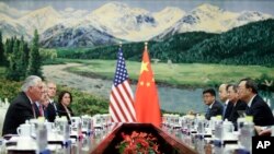 U.S. Secretary of State Rex Tillerson, left, meeting with China's State Councilor Yang Jiechi at the Great Hall of the People, Saturday, Sept. 30, 2017, in Beijing, China.