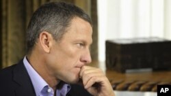 In this January 14, 2013 photo provided by Harpo Studios Inc., cyclist Lance Armstrong listens to a question from Oprah Winfrey during taping for the show "Oprah and Lance Armstrong: The Worldwide Exclusive" in Austin, Texas. 