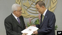Palestinian President Mahmoud Abbas, left, gives a letter requesting recognition of Palestine as a state to Secretary-General Ban Ki-moon during the 66th session of the General Assembly at United Nations headquarters, September 23, 2011.
