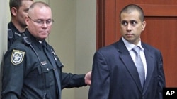 George Zimmerman, right, enters the courtroom, April 20, 2012, during a bond hearing in Sanford, Florida.