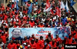 Supporters of Venezuelan President Nicolas Maduro take part in a rally in support of the government in Caracas, April 6, 2019.
