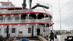 In this Nov. 29, 2018, photo, Matt Dow, project manager for the restoration of the City of New Orleans riverboat, walks on the vessel in New Orleans. The paddlewheel riverboat will soon be taking tourists on excursions around the New Orleans area.
