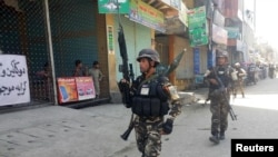 Afghan security forces arrive at the site of an attack in Jalalabad city, eastern Afghanistan May 17, 2017. 