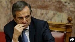 Prime Minister Antonis Samaras attends the third round of voting to elect a new Greek president at the Parliament in Athens, Dec. 29, 2014,