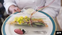 White House Executive Chef Cris Comerford shows the first course for the Japanese State Dinner, a Toro Tartare and Caesar Sashimi Salad, in the State Dining Room of the White House in Washington, DC, on the eve of the State Dinner, April 27, 2015. 