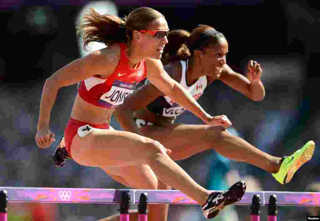 Lolo Jones of the U.S. clears a hurdle with Canada's Phylicia George. Jones is the American record holder in the 60m hurdles with a time of 7.72. She came in fourth in the 100m hurdles final in London.