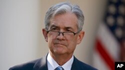 Federal Reserve board member Jerome Powell stands as President Donald Trump announces him as his nominee for the next chair of the Federal Reserve in the Rose Garden of the White House in Washington, Nov. 2, 2017. 