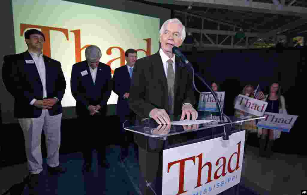 Sen. Thad Cochran, R-Miss., salutes his supporters following his victory over Democrat Travis Childers and Reform Party candidate Shawn O'Hara, Tuesday, Nov. 4, 2014, at his victory party in Jackson, Miss.