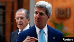 Russia's Foreign Minister Sergey Lavrov and U.S. Secretary of State John Kerry attend a bilateral meeting on the sidelines of the APEC Summit in Bali, Oct. 7, 2013.