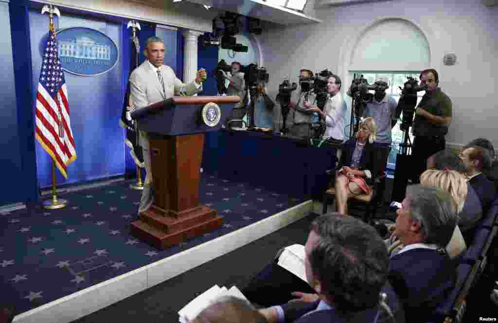 U.S. President Barack Obama addresses reporters in the White House Press Briefing Room ahead of a meeting with his national security council, in Washington, Aug. 28, 2014.