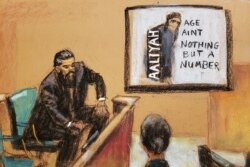 FILE - Case agent Ryan Chabot testifies as a CD cover of the 1994 debut album of late singer Aaliyah's 'Age Ain't Nothing but a Number', produced by R. Kelly, is shown on a screen during R. Kelly's sex abuse trial at Brooklyn's Federal District Court.