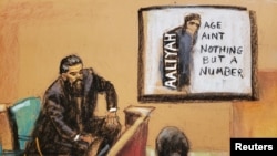 FILE - Case agent Ryan Chabot testifies as a CD cover of the 1994 debut album of late singer Aaliyah's "Age Ain't Nothing but a Number", produced by R. Kelly, is shown on a screen during R. Kelly's sex abuse trial at Brooklyn's Federal District Court in a courtroom sketch in New York, U.S., September 14, 2021.