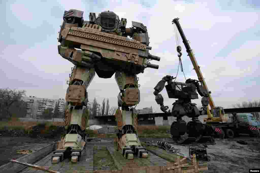 Robots made by local enthusiasts and employees of an automobile repair workshop are seen during installation works on the outskirts of the rebel-controlled city of Donetsk, Ukraine, November 26, 2020. According to creators, who plan to open a robotics eng