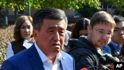 Kyrgyz Presidential candidate Sooronbai Jeenbekov speaks to the media at a polling station in Bishkek, Kyrgyzstan, Oct. 15, 2017. 
