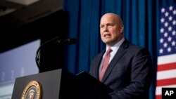 FILE - Acting United States Attorney General Matt Whitaker speaks before introducing President Donald Trump at the 2018 Project Safe Neighborhoods National Conference in Kansas City, Mo., Dec. 7, 2018. 
