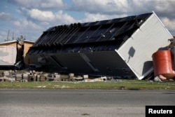 An overturned trailer home damaged by Hurricane Michael is pictured in Springfield, Florida, Oct. 11, 2018.