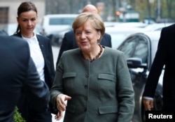 Angela Merkel, leader of the Christian Democratic Union (CDU), arrives at the German Parliamentary Society offices before the start of exploratory talks about forming a new coalition government in Berlin, Germany, Nov. 10, 2017.