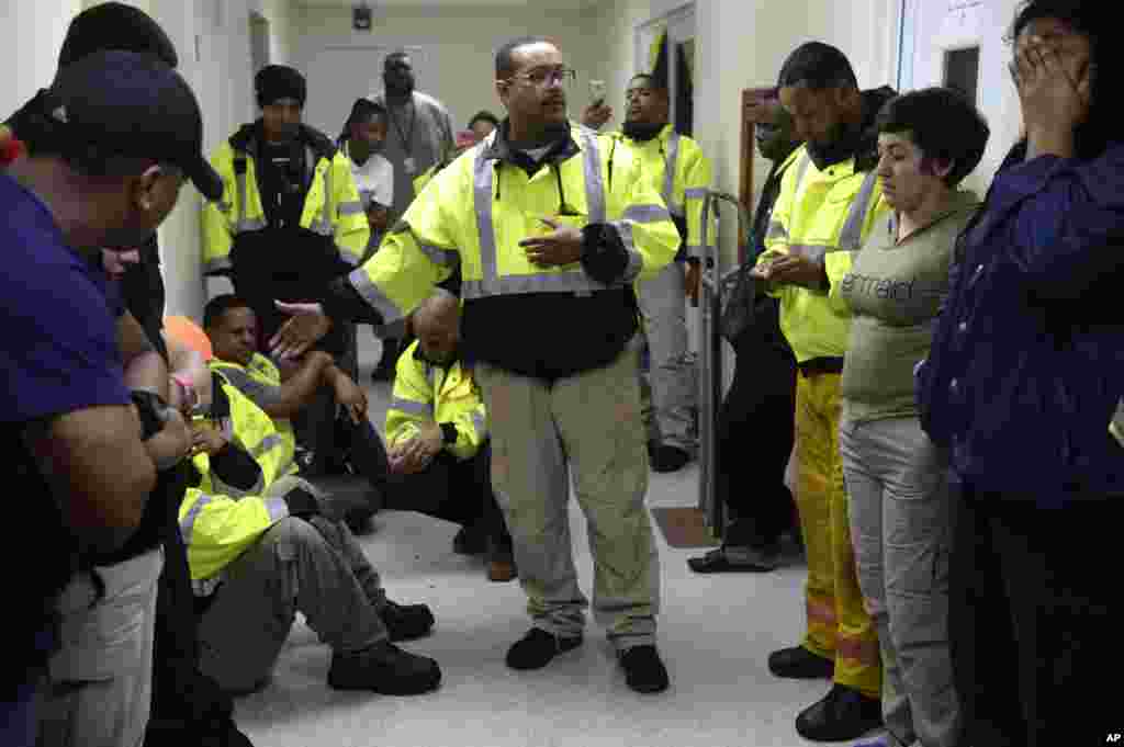 Team leader Joey Rivera gives a speech while the team waits to assist in the aftermath of Hurricane Maria in Humacao, Puerto Rico, Sept. 20, 2017.