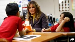 First lady Melania Trump visits with students in a classroom at Dove School of Discovery in Tulsa, Oklahoma, March 4, 2019, during a two-day, three-state swing to promote her Be Best campaign. 