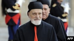 FILE - Lebanese Maronite Cardinal Nasrallah Boutros Sfeir arrives at the Elysee Palace in Paris, before a meeting with French President Nicolas Sarkozy, June 16, 2010. Lebanon's former Maronite patriarch died May 12, 2019.