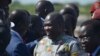 Rebel leader Riek Machar (C) meets with his supporters after landing at Juba international airport on April 26, 2016.