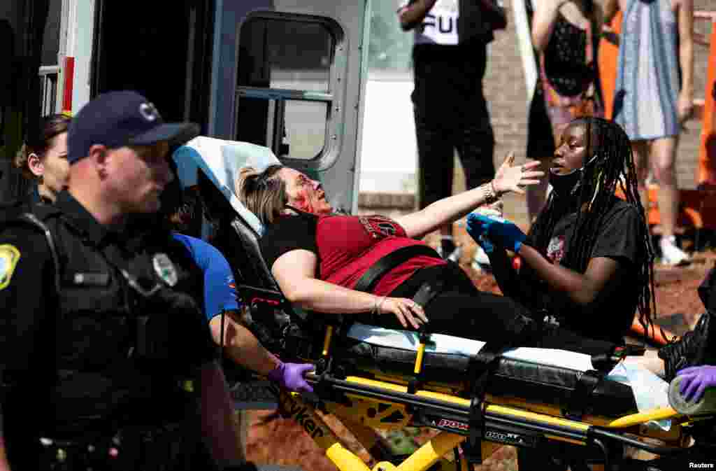 An injured protester is attended to in Columbia, South Carolina, during a rally against the death of George Floyd in Minneapolis police custody, May 30, 2020.
