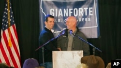 Republican Greg Gianforte (right) welcomes Donald Trump Jr. on to the stage at a rally in East Helena, Mont., May 11, 2017. Trump Jr. urged voters to support Gianforte in the May 25 special U.S. House election to fill the seat of Ryan Zinke, who is now the secretary of the Interior.