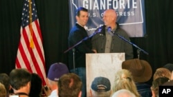 Republican Greg Gianforte (right) welcomes Donald Trump Jr. on to the stage at a rally in East Helena, Mont., May 11, 2017. Trump Jr. urged voters to support Gianforte in the May 25 special U.S. House election to fill the seat of Ryan Zinke, now President Trump's Interior secretary.