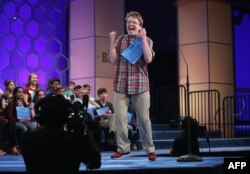 FILE - Jacob Daniel Williamson of Cape Coral, Florida, reacts after he correctly spelled his word during round five of the 2014 Scripps National Spelling Bee competition, May 29, 2014, in National Harbor, Md.