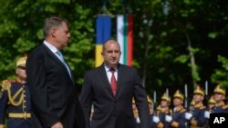 Bulgaria's President Rumen Radev, right, attends a welcoming ceremony with Romanian counterpart Klaus Iohannis at the Cotroceni Presidential Palace in Bucharest, Romania, June 28, 2017.