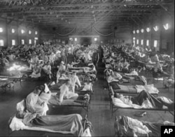 Influenza victims crowd into an emergency hospital near Fort Riley, Kansas in 1918, when the Spanish flu pandemic killed at least 20 million people worldwide. (File Photo)