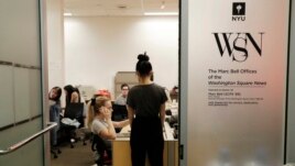 In this this, Sunday, April 22, 2018 photo, while pushing up against a deadline, students collaborate to put out the upcoming edition of the Washington Square News, New York University's independent, student-run, newspaper in New York.