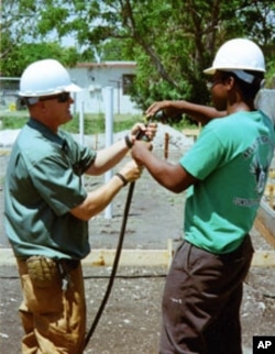 Student Daniel Norzea (right) and instructor Tim Sachse work together at the construction site.