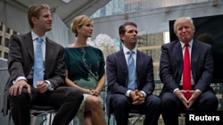 FILE - Donald Trump (R) along with his children Eric (L), Ivanka (2nd L) and Donald Jr. attend a ceremony announcing a new hotel and condominium complex in Vancouver, British Columbia, Canada, June 19, 2013. 