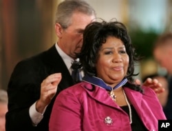 President Bush awards singer Aretha Franklin the Presidential Medal of Freedom Award in the East Room of the White House, Wednesday, Nov. 9, 2005, in Washington.