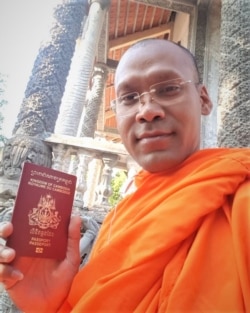 Venerable Seun Ty showed his passport after the Vietnamese authority returned it back to him, in Soc Trang province, Vietnam, Feb. 14, 2020.