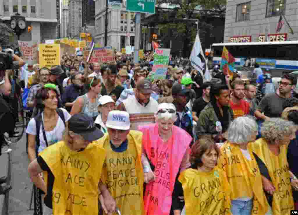 An elderly group leads a march up Broadway towards Police Headquarters, Friday, Sept. 30, 2011, in New York. The "Occupy Wall Street" protest is in its second week, as demonstrators speak out against corporate greed and social inequality. (AP Photo/ Loui