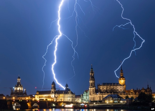 Lightning strikes across the sky in Dresden, Germany, Monday, June 10, 2019. (Robert Michael/dpa via AP)