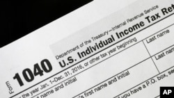 FILE - A 1040 tax form on display in New York, Jan. 10, 2017.
