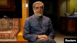Afghan presidential candidate and former foreign minister Abdullah Abdullah speaks during an interview in Kabul, April 9, 2014.