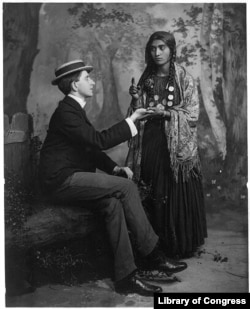 A woman reads a man's fortune in his palm. These types of psychics are called "palm reader." (Library of Congress Photo)