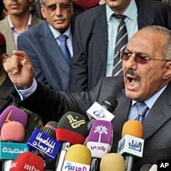 Yemeni President Ali Abdullah Saleh reacts while delivering a speech to his supporters, during a rally in his support in Sana'a, Yemen, May 20, 2011.